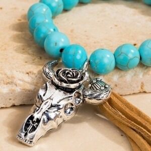 Natural stone bead and steer head charm